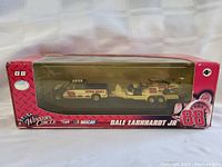 Front view of unopened Dale Earnhardt Jr. NASCAR model vehicle set in box.