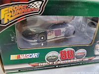 Front view of Dale Earnhardt Jr. #88 NASCAR RC car in original green Front Runners box showing the car and branding.