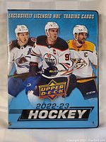 Front cover of the 2022-23 Upper Deck hockey card binder featuring NHL players and branding.
