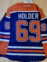 Back view of Reebok Edmonton Oilers hockey jersey with Holder #69 in blue and orange colors