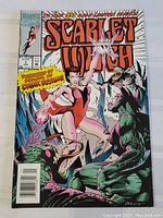 Two images of the front cover of the Scarlet Witch Marvel comic book issue #1 showing the same cover art and details.