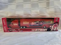 Front view of the boxed Tony Stewart NASCAR transport model showing the truck and racecar with Office Depot branding and number 14 in a red box.