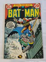 Front cover of vintage Batman comic book No. 247 from February showing cover art with Batman and antagonist in snowy setting, price at 20 cents.