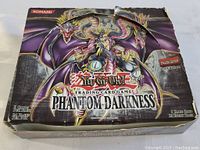 Front view of the Phantom Darkness Yu-Gi-Oh booster box showing artwork, logos, and condition.