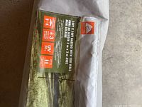 Close-up of the sun wall fabric packaging with product information and brand label.