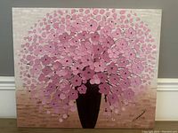 Full view of the signed oil painting showing the pink flower arrangement in a vase with light brown and pale background.