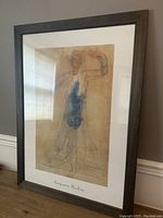 Full framed print artwork by Auguste Rodin showing the entire framed piece leaning against a wall.