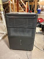 Front view of the black Danby Premiere dehumidifier showing ventilation grille and general body condition.