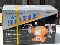 Photo of the sealed box of Central Machinery 6 inch bench grinder showing product name, image, and basic features.