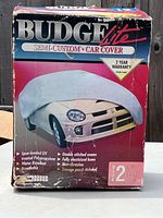 Front of box showing brand, product type, and car cover image.