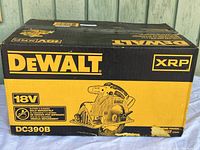 Front side of the box with DeWalt and XRP branding, 18V power specification, and model DC390B image and labeling.