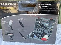 Front of the sealed box showing Husky 4-tool 53-piece air tool kit branding and item photos.