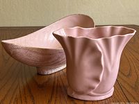 Front and side views of matte pink ceramic vase with ruffled top edge and USA 732 marking, paired with oblong pink bowl with gold speckles.