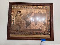 Front view of framed vintage Moses Pitt 1682 world map print showing detailed antique map and decorative borders.