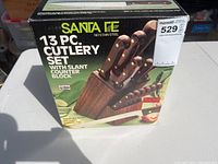 Photo of the unopened box showing the Santa Fe 13-piece cutlery set with slant counter block.