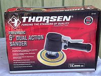 Box of Thorsen 6-inch dual action pneumatic sander showing front with brand, model and product features.