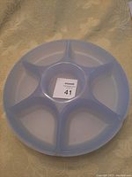 Top view of the container showing five compartments with a center dip spot.