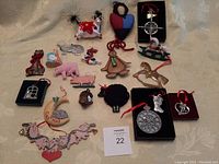 Full assortment of the lot on a cream quilted cloth background showing all individual items arranged for identification and counting