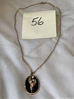 Full view of the pendant on chain with seller's lot number