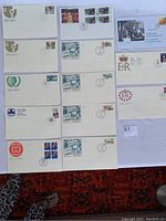 Full view of 13 Canadian first day covers showing variety of cachets and stamps focused on women and royalty themes.