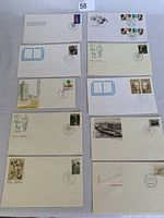 Photo showing all 10 Canadian first day covers displayed in rows with various stamps and cancellation marks visible.