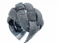 Photo showing the braided woven mesh design of the silver-toned cuff bracelet.