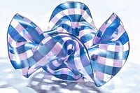 Candle holder shaped like a delicate handkerchief with blue and pink striped pattern in acrylic, shown from front view