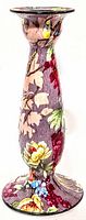 Front view of the tall hand painted chintz ceramic candlestick showing detailed floral and butterfly decorations on a purple background.