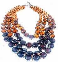 Full view of the vintage lucite multi-strand necklace showing bead strands and clasp.