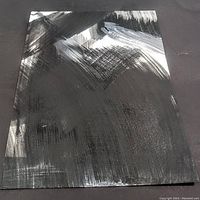Overall photo showing abstract black and white painting with broad brushstrokes on paper.