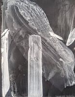 Close-up of abstract acrylic painting showing textured white brushstrokes on black background.