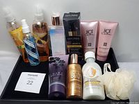 Photo showing all beauty supplies lot items arranged on black surface