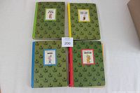 Four vintage Wonderful World of Walt Disney hardcover books arranged in a grid showing covers with green patterned cloth and colored spines and small framed Disney character illustrations.