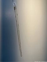 Photo showing full length of the delicate 18 inch gold-plated necklace from Shahi Jewelry with clasp detail.