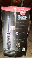 Photo of boxed Hoover FloorMate hard floor cleaner showing front side of the packaging with product image and features.