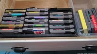 Tray of NES cartridges, top-down view