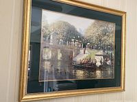 Full view of framed painting showing park and river scene under glass