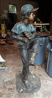 Front view of full statue on base in garage setting