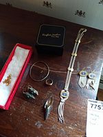 Group shot of all jewelry items on wooden surface