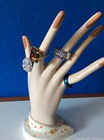 Porcelain hand display with 4 rings on the fingers