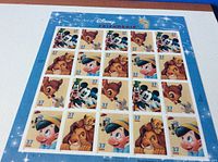 Full sheet of 20 Disney-themed postage stamps featuring various characters.