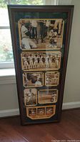 Full view of the framed Roberto Clemente photo montage measuring approximately 42x16 inches, showcasing multiple black and white images.