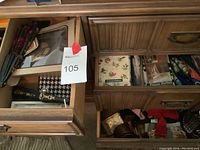Drawer overview showing assorted belts and accessories