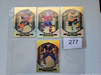 Photo of four Tim Hortons Gold Etching hockey insert trading cards featuring Connor McDavid, Alex Ovechkin, Sidney Crosby, and Leon Draisaitl in protective sleeve.