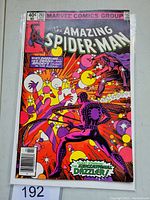 Front cover of The Amazing Spider-Man #203 comic book, showing colorful psychedelic cover art with Spider-Man and Dazzler.