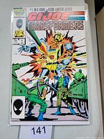 Front cover of G.I Joe and The Transformers #1 Marvel comic book showing detailed artwork with soldiers and robot explosion