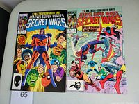 Front covers of Marvel Super Heroes Secret Wars #2 and #3 comic books, showing character artwork and title.