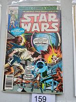 Front cover of Star Wars #5 comic showing Luke Skywalker and action scene near Death Star, comic in protective sleeve.