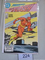 Front cover of The Flash #1 comic book featuring The Flash character and city/military background