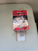 Sealed unopened box of 2019 Toronto Raptors NBA Champions basketball cards sitting on a table showing the front side of the box with team photo and Panini branding.